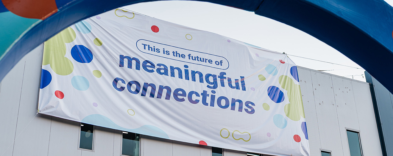 Banner outside The Office Gurus facility reading "This is the future of meaningful connections