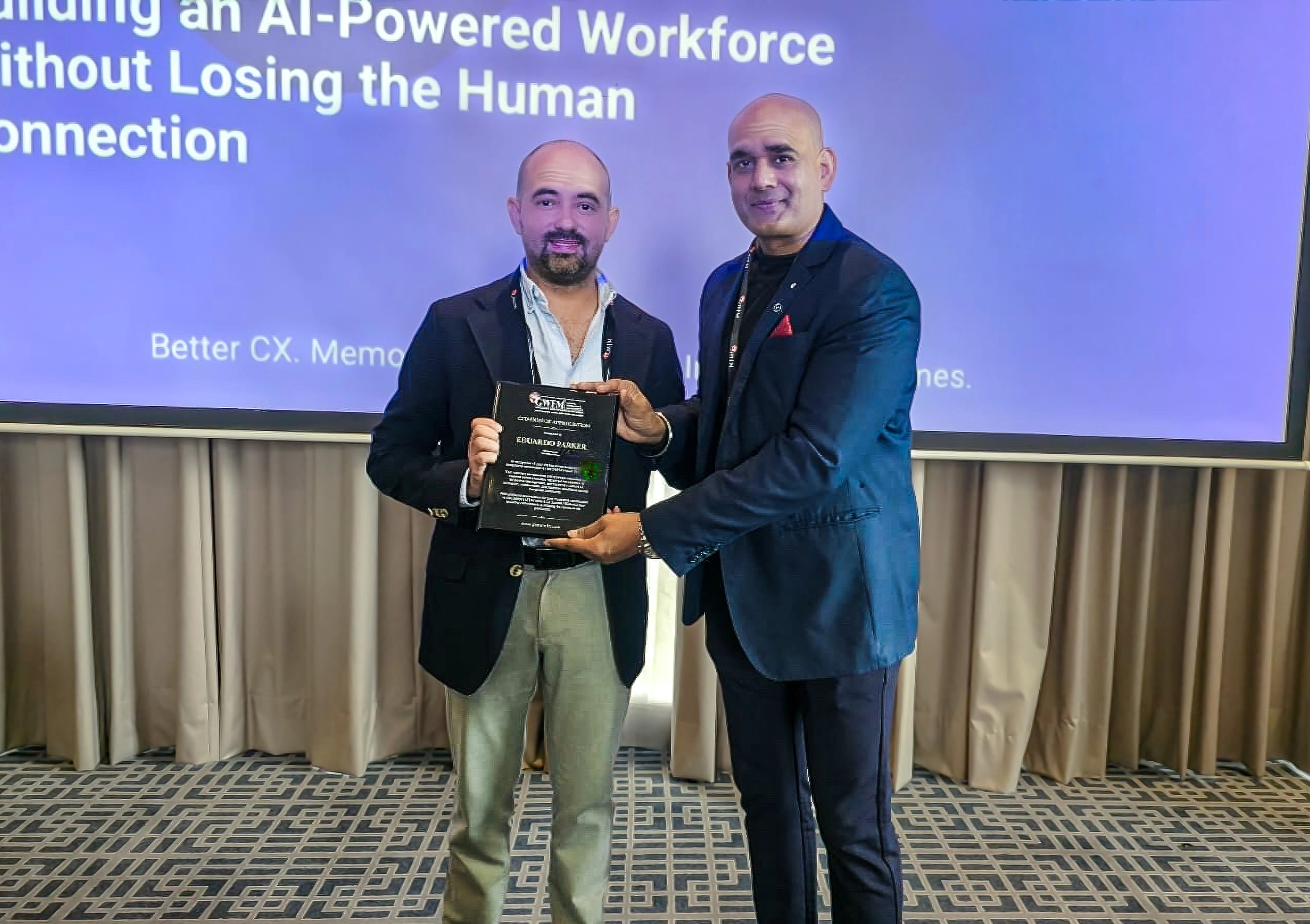 Eduardo Parker receiving a GWFM Citation of Appreciation plaque